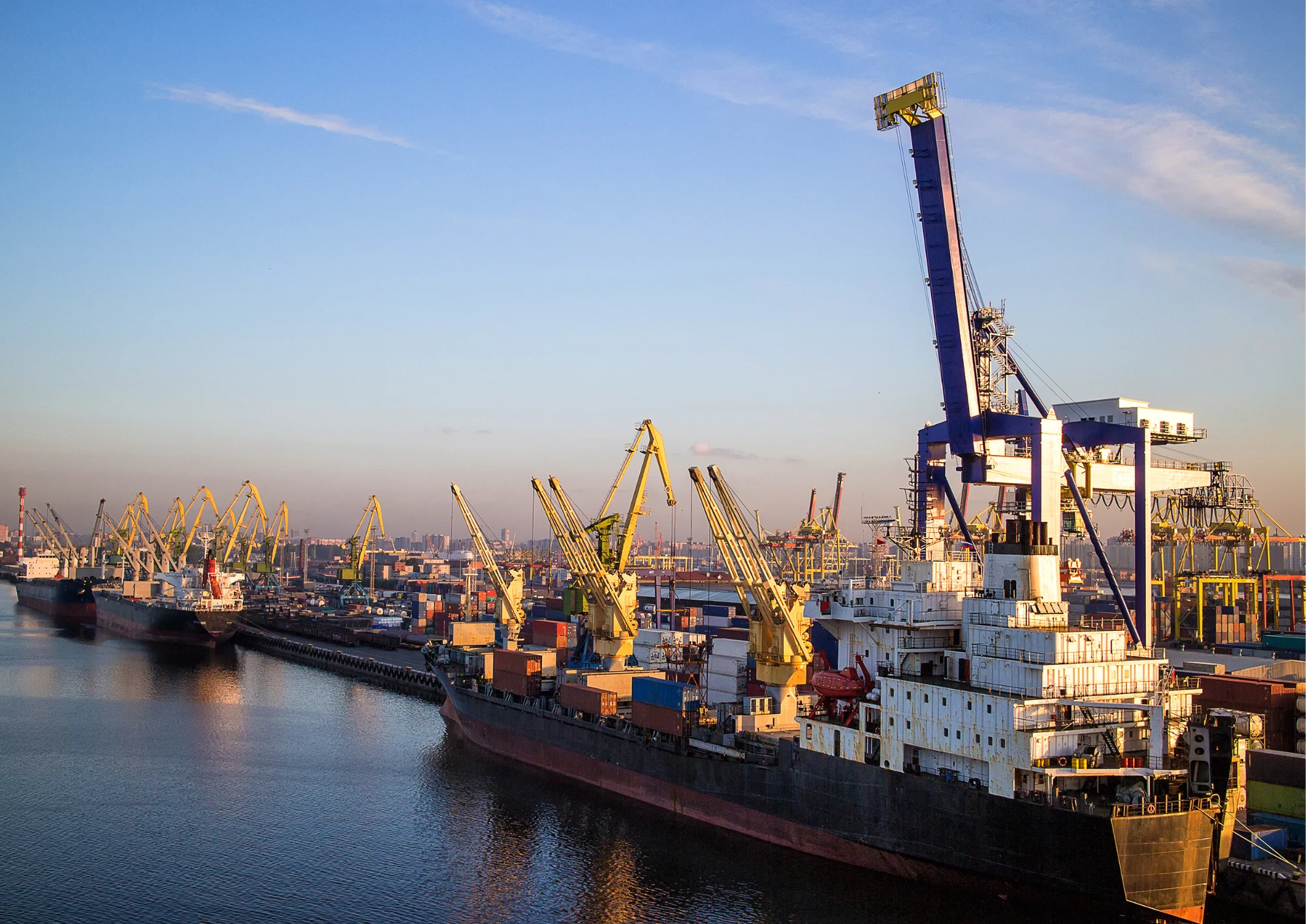 A large tanker ship navigating through calm waters, symbolizing global commodity trade and logistics.