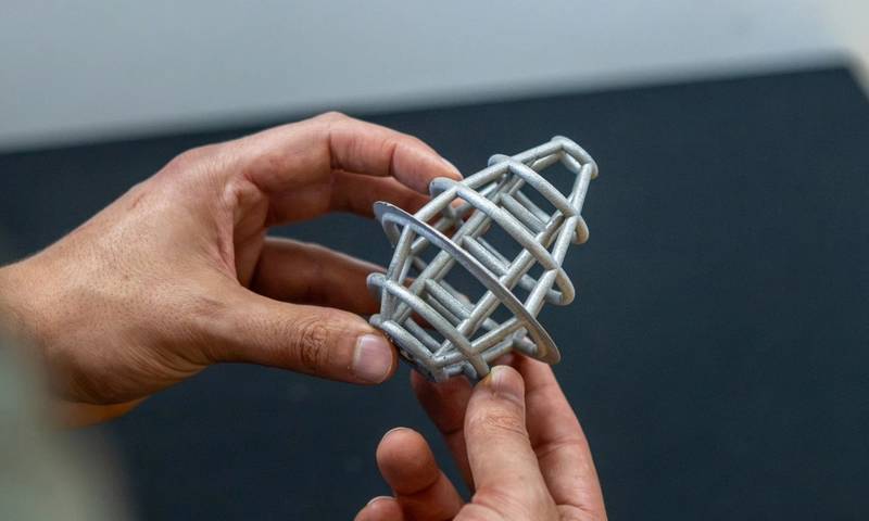 A 3D-printed titanium lattice structure floating on water